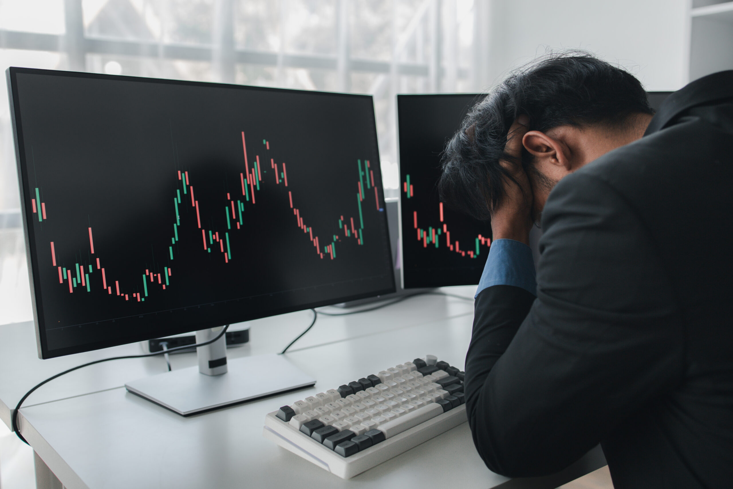 Stock investor with stock market graph screen, he stressed, stock market volatility analysis, business man is trading stocks for profit, stock market volatility graph screen, profit trading analysis.